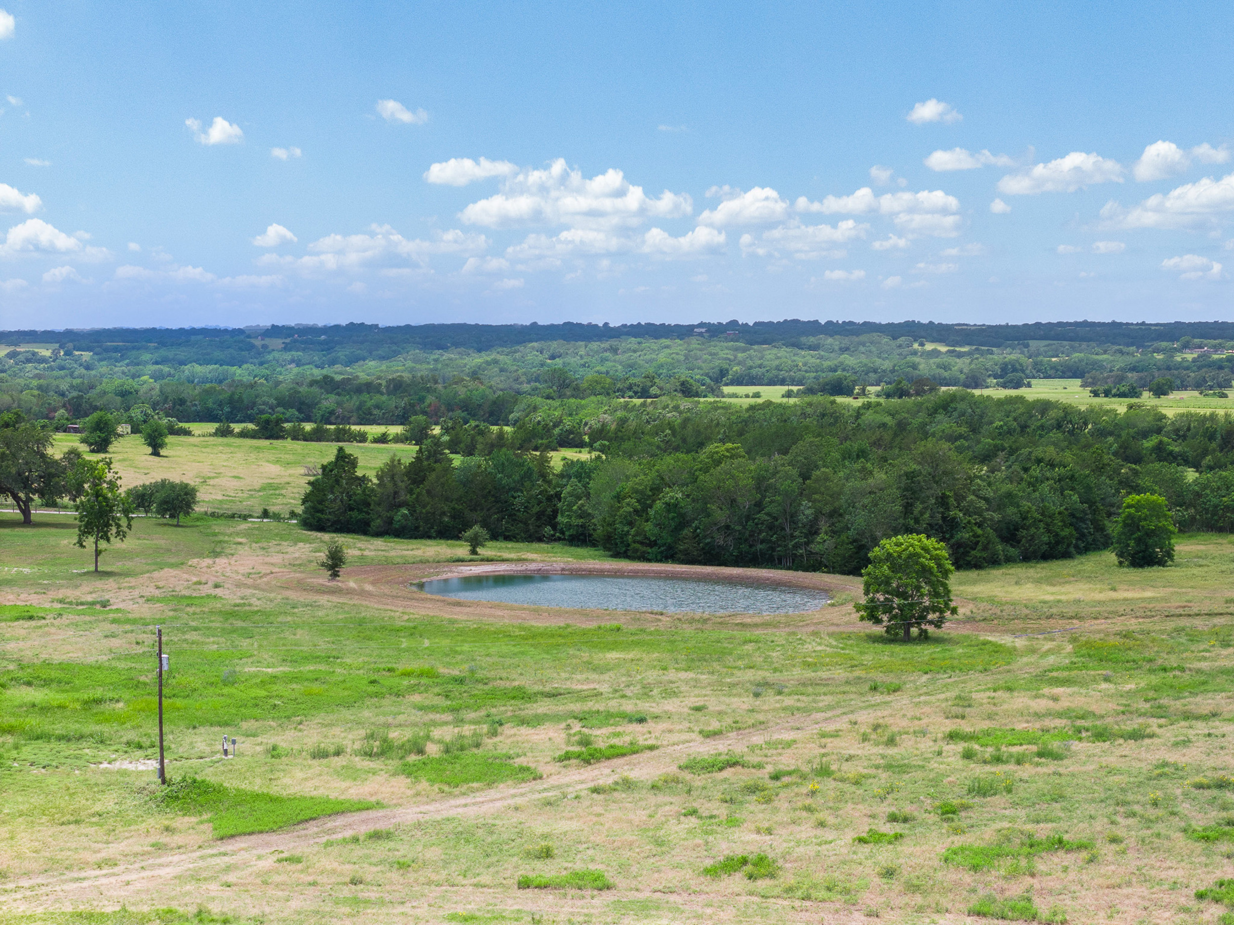 Lot 2 — pond and open sky at The Clearing