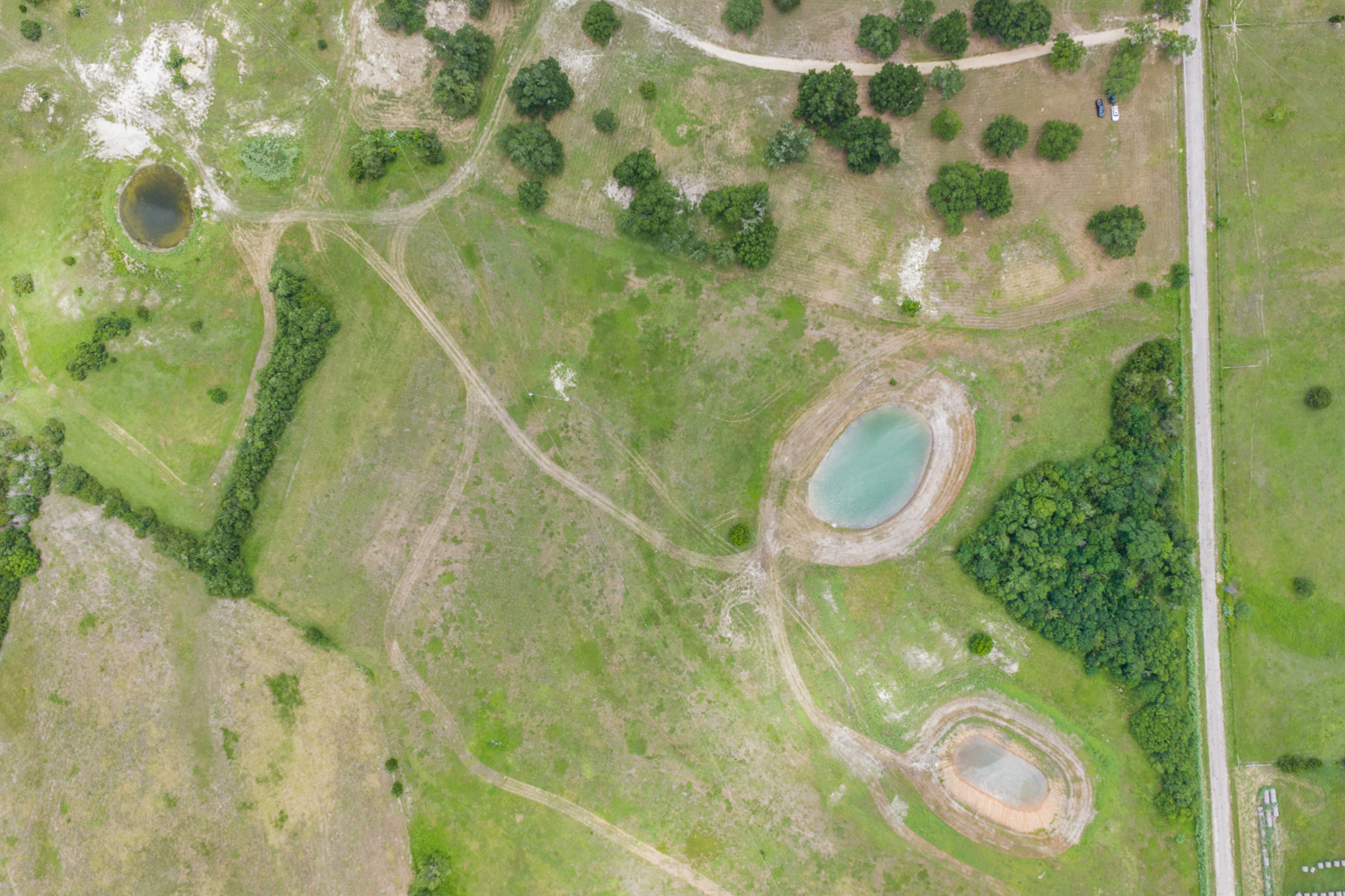 Aerial land and pond at The Clearing