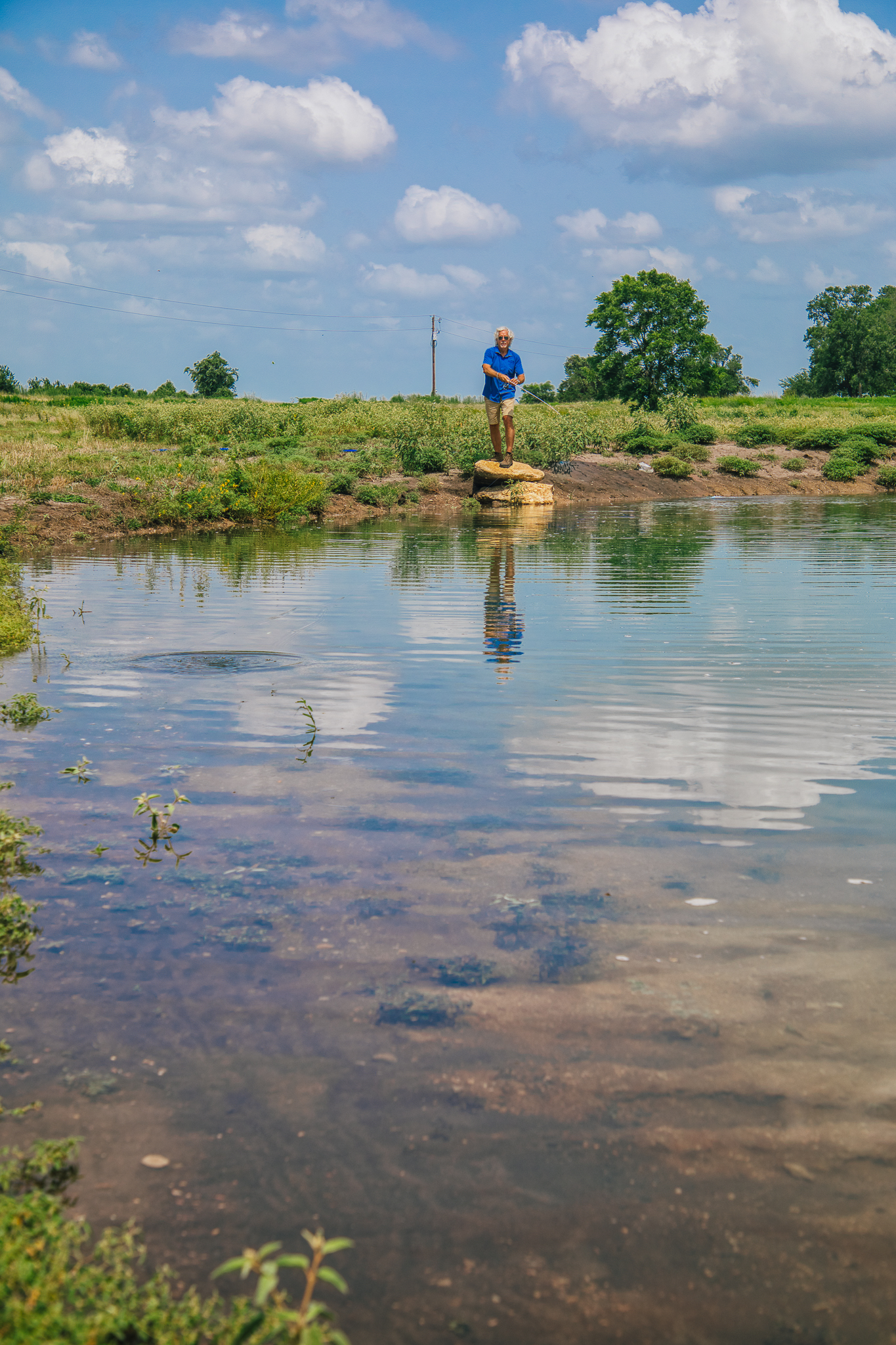 Man fishing on dock at Lot 3